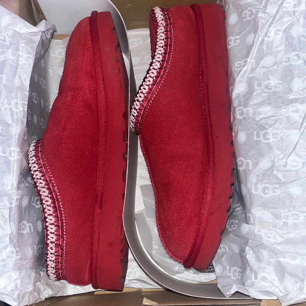Red Tasman Slippers with white trim.